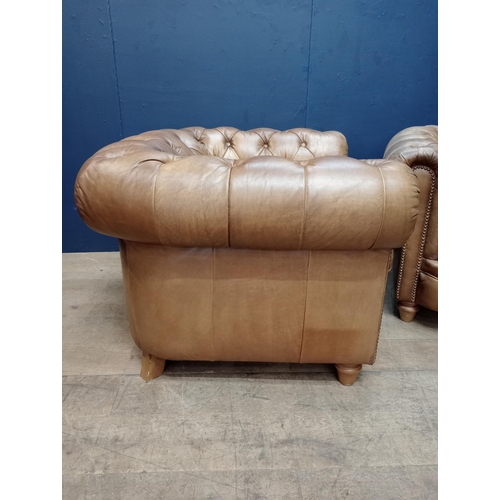 392 - A PAIR OF HIDE UPHOLSTERED CLUB CHAIRS each with deep buttoned upholstered scroll over back and arms... 