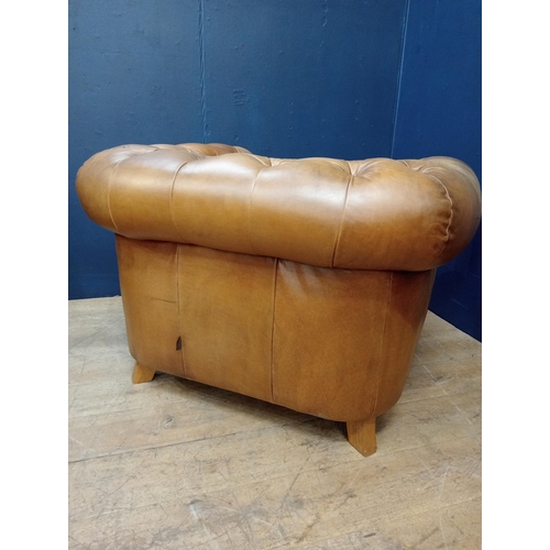 392 - A PAIR OF HIDE UPHOLSTERED CLUB CHAIRS each with deep buttoned upholstered scroll over back and arms... 