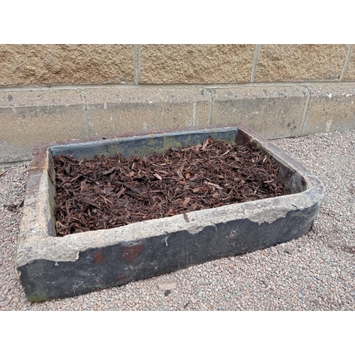 396 - A GLAZED SANDSTONE SINK of rectangular form with bung plug 12cm (h) x 74cm (w) x 51cm (d)