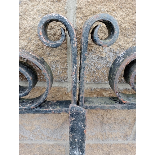 728 - A PAIR OF VINTAGE CAST IRON ENTRANCE GATES with cylindrical barring and sphere head finials with scr... 