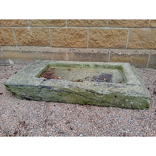 725 - A LIMESTONE TROUGH of rectangular outline 14cm (h) x 111cm (w) x 56cm (d)