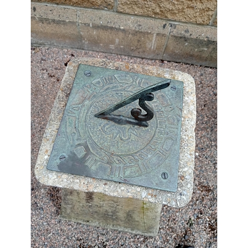 726 - A COMPOSITION STONE AND BRONZE SUNDIAL of rectangular spreading form with bronze embossed dial 75cm ... 