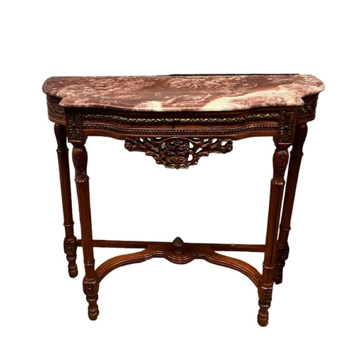 402 - A CONTINENTAL MAHOGANY PARCEL GILT AND MARBLE CONSOLE TABLE of serpentine outline the shaped veined ... 