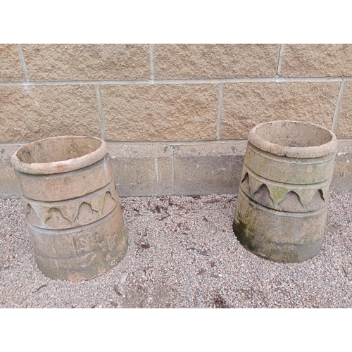 405 - A PAIR OF TERRACOTTA GLAZED CHIMNEY POTS each of cylindrical spreading form 36cm (h) x 29cm (d)