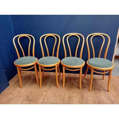 406 - A SET OF FOUR BENTWOOD CHAIRS each with an arched top rail and splat with upholstered seats on cylin... 