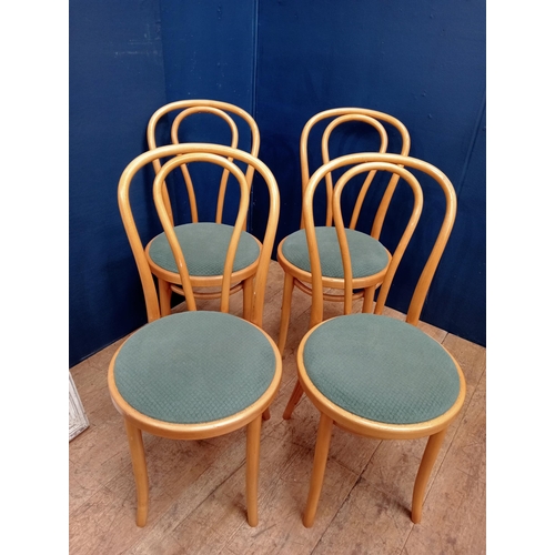 406 - A SET OF FOUR BENTWOOD CHAIRS each with an arched top rail and splat with upholstered seats on cylin... 