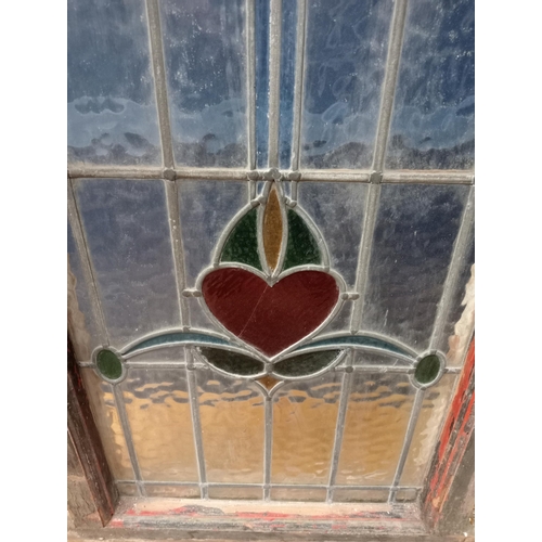 410 - A VINTAGE LEAD GLASS AND STAINED GLASS WINDOW in pine frame 122cm (h) x 81cm (w) x 13cm (d)