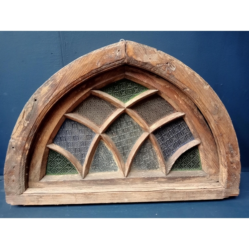 412 - A 19TH CENTURY OAK STAINED GLASS FAN LIGHT WINDOW of demi lune outline 63cm (h) x 94cm (w) x 55cm (d... 