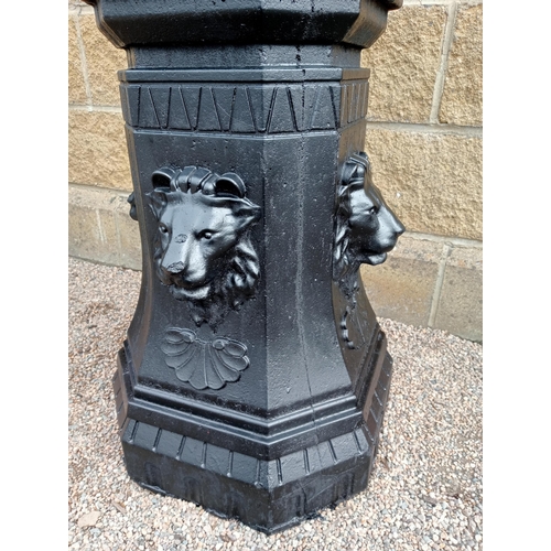 418 - A PAIR OF CAST IRON AND COMPOSITION STONE URNS ON PEDESTALS each of semi lobed campana form on a rec... 