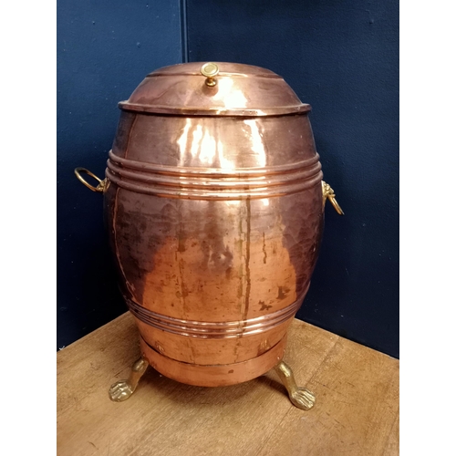 422 - A 19TH CENTURY COPPER CONTAINER of cylindrical form with hinged lid and shovel with brass lion mask ... 