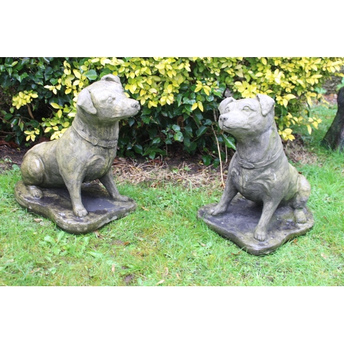 423 - A PAIR OF COMPOSITION STONE FIGURES each modelled as a dog shown seated on a shaped platform 42cm (h... 