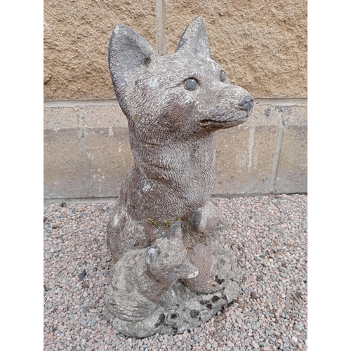 425 - A COMPOSITION STONE FIGURE modelled as a fox and cubs on a platform base 42cm (h) x 26cm (w) x 24cm ... 