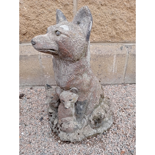 425 - A COMPOSITION STONE FIGURE modelled as a fox and cubs on a platform base 42cm (h) x 26cm (w) x 24cm ... 