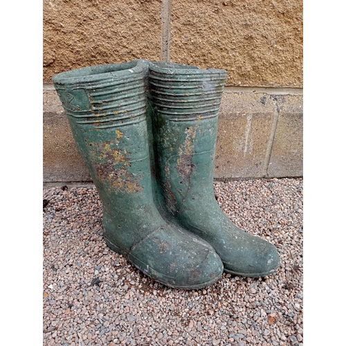 426 - A PAIR OF COMPOSITION STONE PLANTERS modelled as wellington boots 35cm (h) x 38cm (w) x 25cm (d)