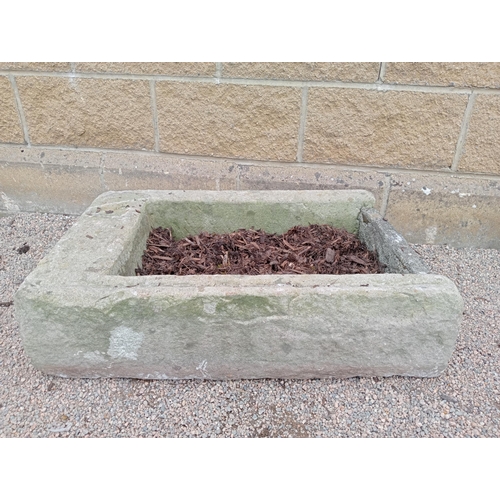 427 - A SANDSTONE TROUGH of rectangular form 20cm (h) x 82cm (w) x 54cm (d)