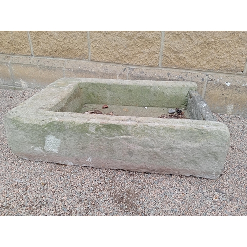 427 - A SANDSTONE TROUGH of rectangular form 20cm (h) x 82cm (w) x 54cm (d)