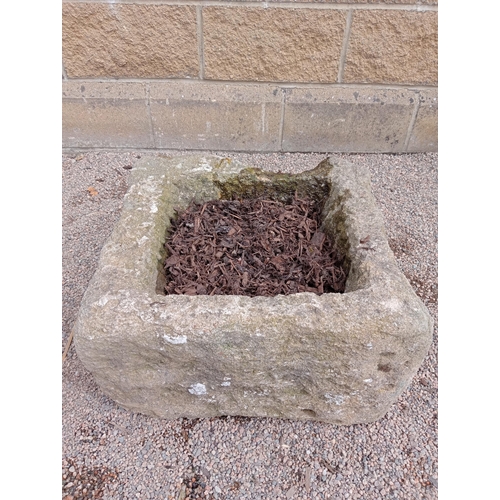 429 - A COMPOSITION STONE TROUGH of square form 32cm (h) x 53cm (w) x 53cm (d)