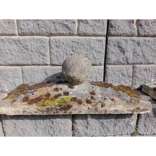 430 - A PAIR OF COMPOSITION STONE PIER CAPS each of rectangular form with spherical finial 40cm (h) x 90cm... 