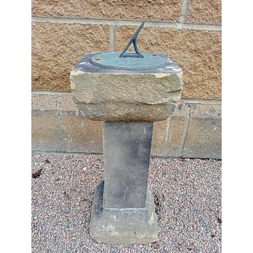 434 - A COMPOSITION STONE SUNDIAL of rectangular form with bronze engraved dial on a spreading foot 52cm (... 