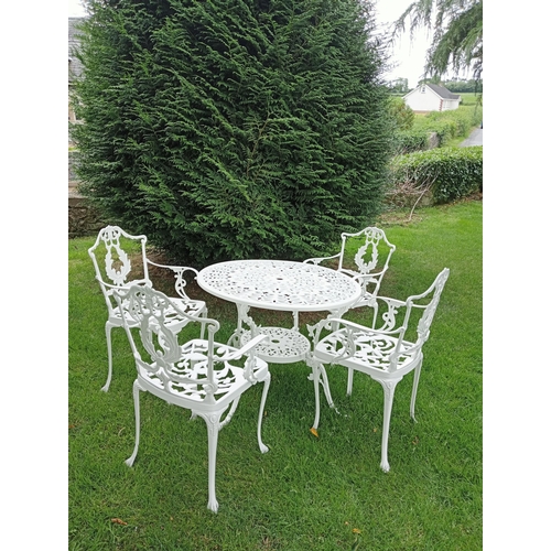 445 - A FIVE PIECE ALUMINIUM PATIO SUITE comprising four elbow chairs each with a pierced foliate back and... 