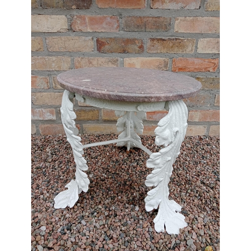 446 - A 19TH CENTURY CAST IRON AND MARBLE TABLE the circular veined marble top raised on foliate cast legs... 