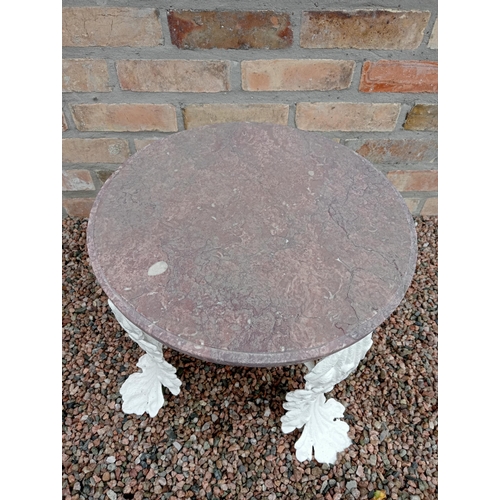 446 - A 19TH CENTURY CAST IRON AND MARBLE TABLE the circular veined marble top raised on foliate cast legs... 