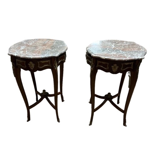 456 - A PAIR OF CONTINENTAL KINGWOOD AND GILT BRASS MOUNTED TABLES the shaped veined marble top with shape... 