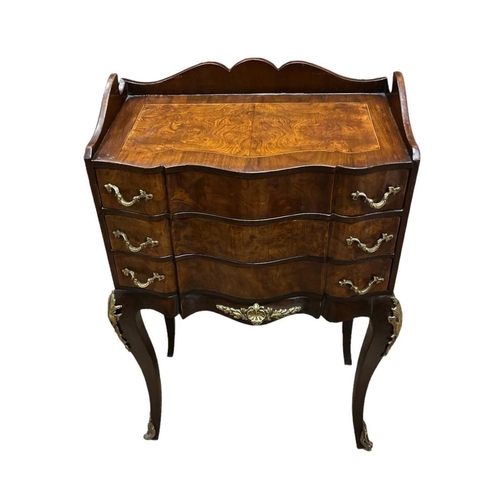 458 - A CONTINENTAL WALNUT KINGWOOD AND GILT BRASS MOUNTED CHEST of serpentine outline the shaped top with... 