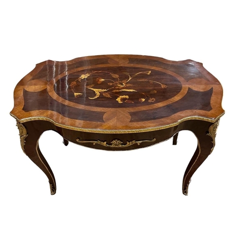 460 - A CONTINENTAL KINGWOOD MARQUETRY AND GILT BRASS MOUNTED COFFEE TABLE of serpentine outline the shape... 