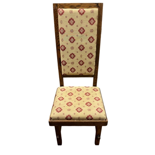 469 - AN OAK HIGH BACK CHAIR the rectangular back with upholstered panel and seat on square moulded legs t... 