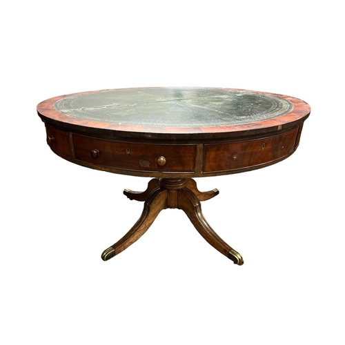 472 - A GEORGIAN MAHOGANY RENT TABLE the circular top with tooled leather inset above four true and four f... 