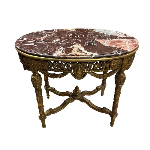 473 - A CONTINENTAL GILTWOOD AND MARBLE CENTRE TABLE of oval outline surmounted by a veined marble top wit... 