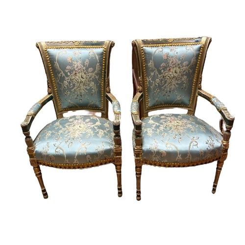 476 - A PAIR OF CONTINENTAL GILTWOOD POLYCHROME AND UPHOLSTERED SALOON CHAIRS each with a scroll top rail ... 