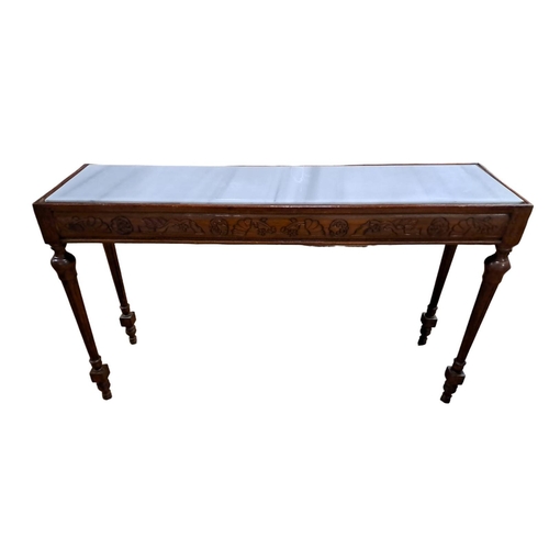 49 - A CONTINENTAL MAHOGANY CONSOLE TABLE of rectangular outline the shaped top with marble inset above a... 