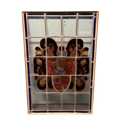 509 - A VINTAGE LEAD GLASS CLEAR GLASS AND STAINED GLASS PANEL depicting a coat of arms 97cm (h) x 66cm (w... 