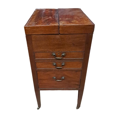 52 - A GEORGIAN MAHOGANY DRESSING STAND of rectangular outline the hinged lids containing a fall and rise... 