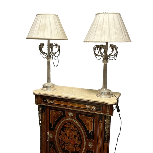 538 - A PAIR OF PLATED TABLE LAMPS each with a reeded column issuing five scroll arms with bird finials hu... 