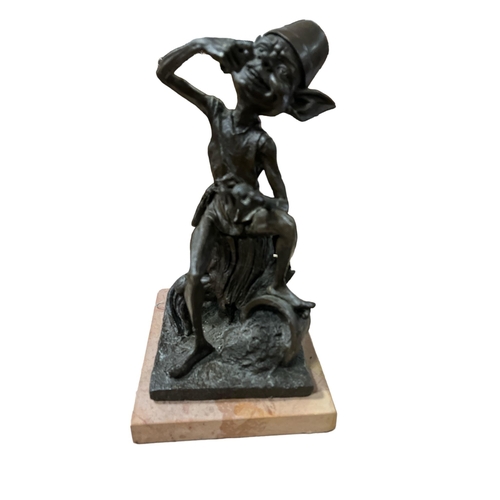 539 - A BRONZE FIGURE modelled as a pixie shown seated on a tree stump raised on a marble base 25cm (h) x ... 