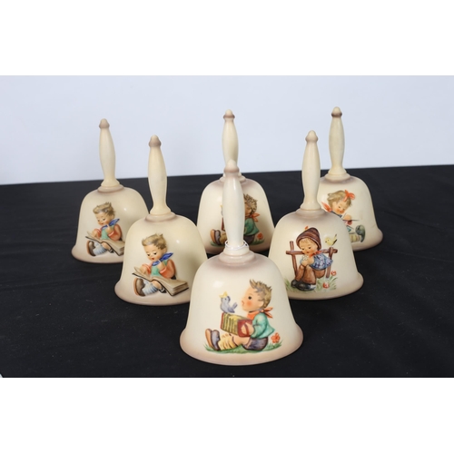 551 - SIX HUMMEL ANNUAL BELLS of ovoid form moulded in relief Each 16cm (h)