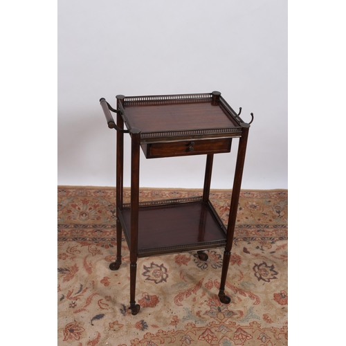 574 - A CONTINENTAL MAHOGANY AND GILT BRASS MOUNTED TWO TIER STAND of square outline the shaped top with p... 