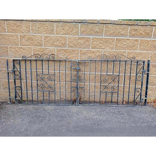 723 - A PAIR OF WROUGHT IRON ENTRANCE GATES with rectangular barring and scroll decoration 104cm (h) x 274... 