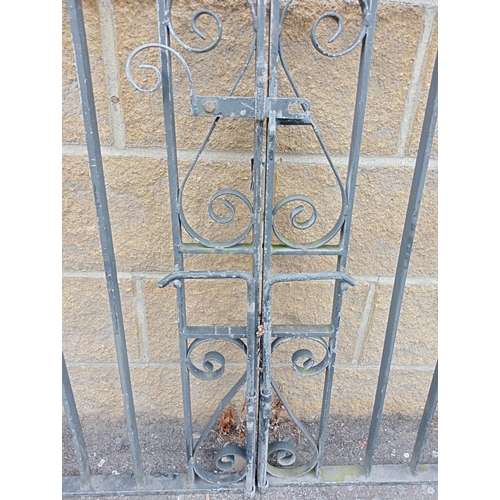 723 - A PAIR OF WROUGHT IRON ENTRANCE GATES with rectangular barring and scroll decoration 104cm (h) x 274... 