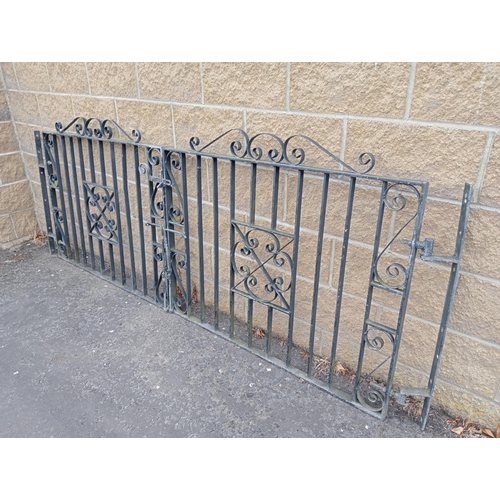 723 - A PAIR OF WROUGHT IRON ENTRANCE GATES with rectangular barring and scroll decoration 104cm (h) x 274... 