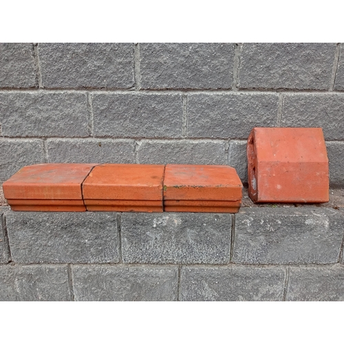 724 - TWENTY FOUR TERRACOTTA CAPPINGS each of rectangular shaped form 14cm (h) x 720cm (w) x 33cm (d)