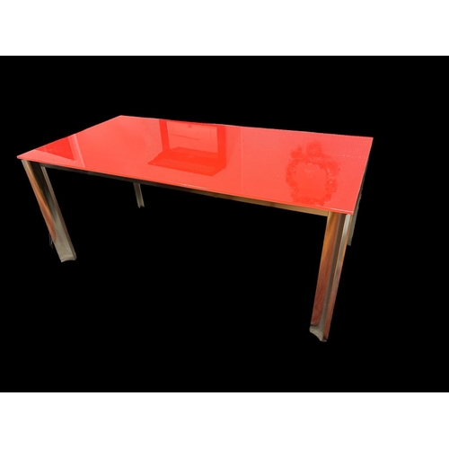 715 - A DESIGNER CHROME AND GLAZED TABLE of rectangular outline on shaped chrome legs 74cm (h) x 181cm (w)... 