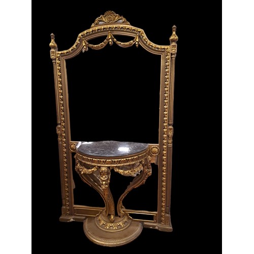 77 - A CONTINENTAL CARVED GILTWOOD CONSOLE TABLE AND MIRROR the rectangular shaped mirror within a foliat... 