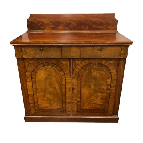 21 - A GEORGIAN MAHOGANY CROSSBANDED SIDE CABINET of rectangular outline the shaped top with moulded back... 