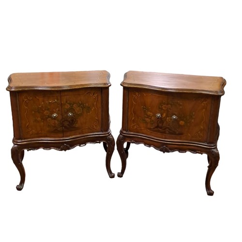 236 - A PAIR OF CONTINENTAL WALNUT AND POLYCHROME SIDE CABINETS each of serpentine outline the shaped tops... 