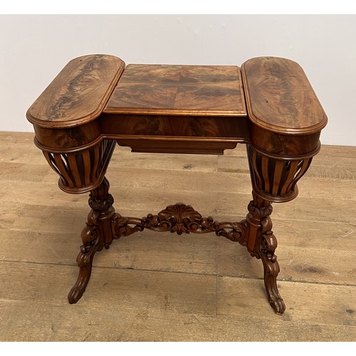 391 - A 19TH CENTURY MAHOGANY SEWING TABLE the shaped top with hinged compartments containing a fitted sli... 