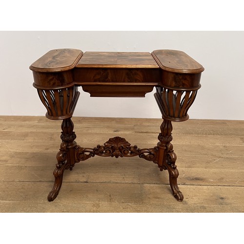 391 - A 19TH CENTURY MAHOGANY SEWING TABLE the shaped top with hinged compartments containing a fitted sli... 